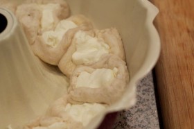Place half of your discs around your bundt pan with cream cheese facing up