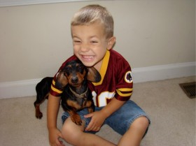My adorable little wiener dog snuggling up with my baby! How could you not love her!