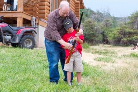 Showing Casey how to work the gun.