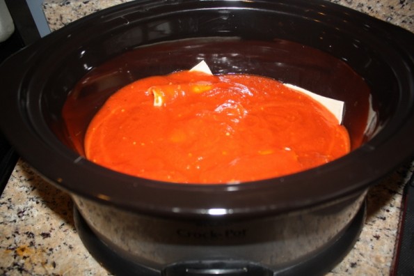 sauce covering chicken in crock pot