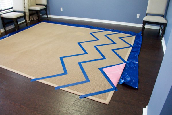 Notice my pink construction paper triangle.  I used this to measure and make sure my chevron strips were uniform.